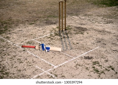 Cricket Bat On Empty Cricket Pitch To Play.