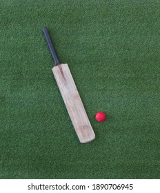cricket bat on green grass
