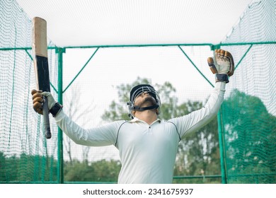 Cricket batsman celebrating his success and feeling happy - Powered by Shutterstock