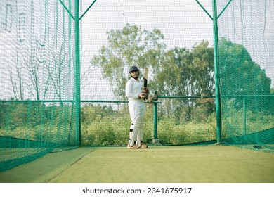 Cricket Batsman waiting bowler to bowl. Player ready to do more practice in nets - Powered by Shutterstock