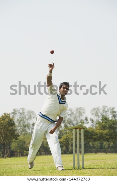 Cricket bowler in\
action