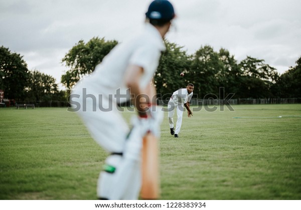 Cricket bowler throwing the
ball
