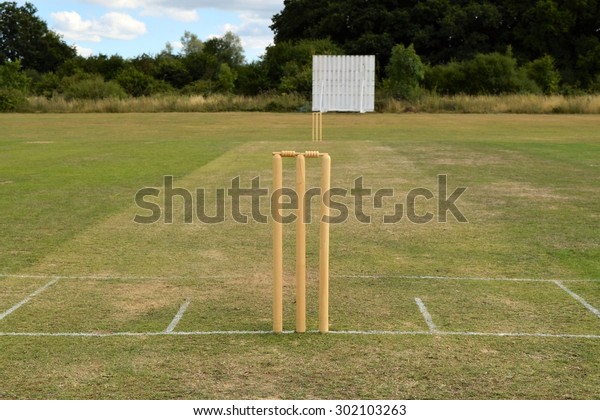 Cricket pitch with wicket\
and stumps