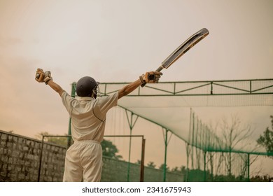 Cricket player celebrating his success after a match during his practicing time  - Powered by Shutterstock