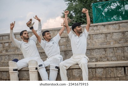 Cricket players encouraging their teammates during cricket match at the stadium - Powered by Shutterstock