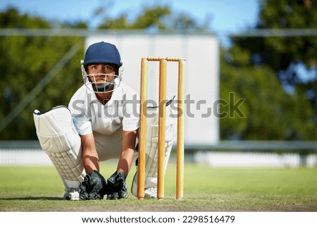 Cricket, sports and a man as wicket keeper on a pitch for training, game or competition. Male athlete behind stumps with gear for action, playing professional sport and exercise for fitness or mockup