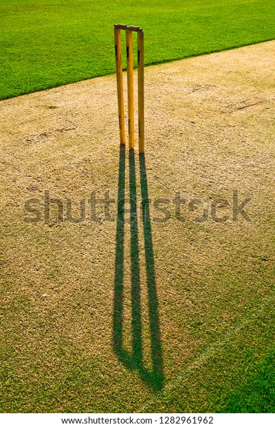 Cricket Stumps Casting Shadow On Green Stock Photo (Edit Now) 1282961962