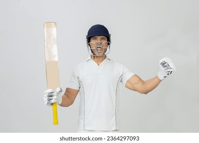 Cricketer in full Joy expression screaming towards the camera, Man in cricket dress screaming in joy and celebrating victory - Powered by Shutterstock