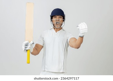 Cricketer in full Joy expression screaming towards the camera, Man in cricket dress screaming in joy and celebrating victory - Powered by Shutterstock