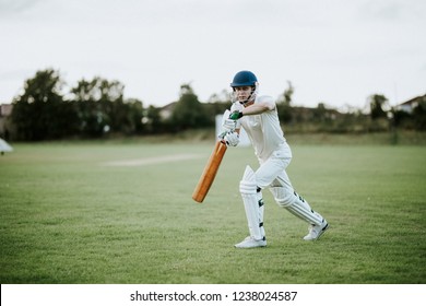 Cricketer on the field in action - Powered by Shutterstock