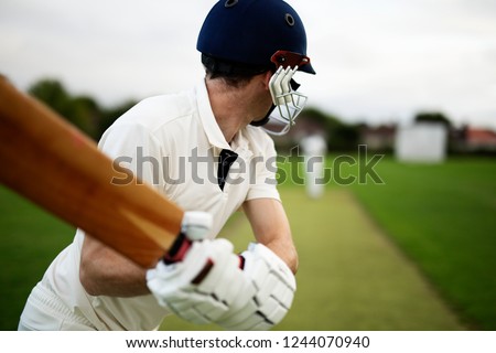 Cricketer on the field in action