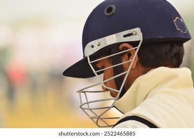 cricketer on the field thinking. - Powered by Shutterstock