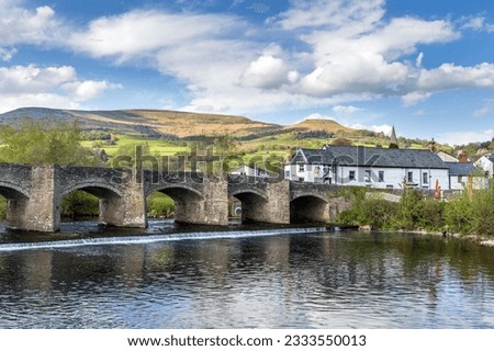 The Crickhowell Bridge, an 18th century arched stone bridge spanning the river Usk in Crickhowell, Brecon Beacons, Powys, Wales, the longest stone bridge in Wales.