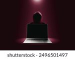 Crime and attack technology concept by hacker , Grey laptop with black blank screen and red hacker attack blurred in a red darkness background with lights shining down from above.