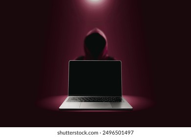 Crime and attack technology concept by hacker , Grey laptop with black blank screen and red hacker attack blurred in a red darkness background with lights shining down from above.