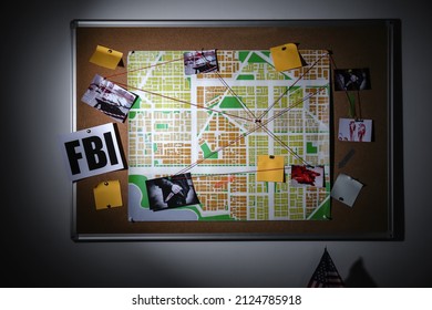 Crime board hanging on wall in police department at night - Shutterstock ID 2124785918