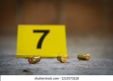 Crime Scene. 9 Mm Bullet Shells Lying On The Ground