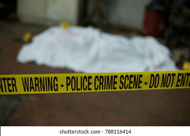 Crime Scene Band And Covered Dead Body In Background. 