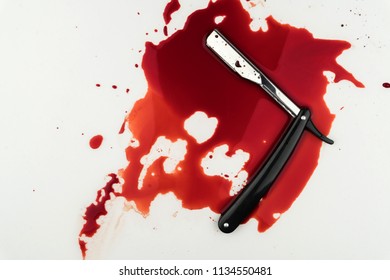 Crime Scene Concept, A Vintage Straight Razor In Pool Of Blood