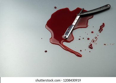 Crime Scene Concept, A Vintage Straight Razor In Pool Of Blood