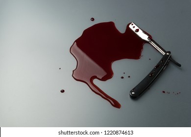 Crime Scene Concept, A Vintage Straight Razor In Pool Of Blood