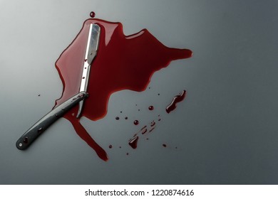 Crime Scene Concept, A Vintage Straight Razor In Pool Of Blood