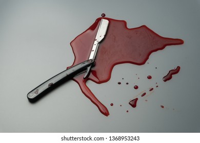 Crime Scene Concept, A Vintage Straight Razor In Pool Of Blood