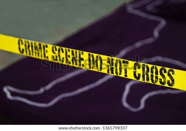 Crime scene - Do not
cross. Chalk outline of murdered victim of Violence with Evidence 
around.           