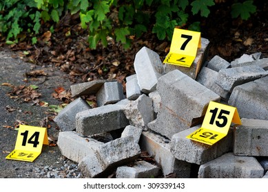 Crime Scene Evidence Markers Next To Concrete