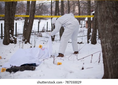 Crime Scene. Forensic Is Lifting The Cover To Check The Body. 