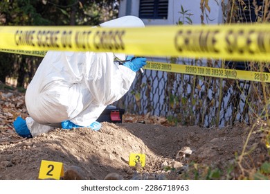 Crime scene investigation. Forensic science specialist working on human remains identification.