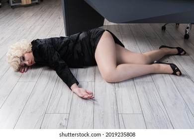 Crime scene with strangled pretty business woman in office