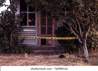 Crime Scene Tape Near The House, Police Tape Do Not Cross Outdoors