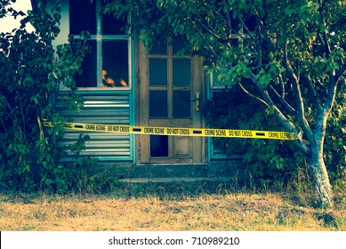 Crime Scene Tape Near The House, Police Tape Do Not Cross Outdoors