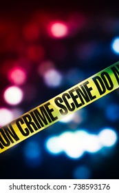 Crime scene tape with red and blue lights on the background