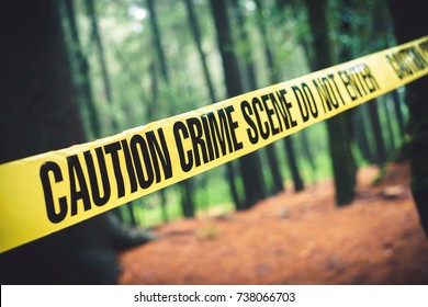 Crime scene tape in the woods / Selective focus