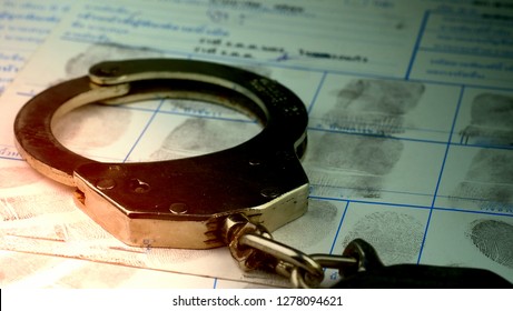 Crime And Violence Concept.Police Handcuffs On Fingerprints Crime Page File 