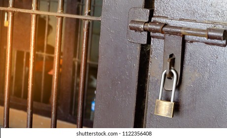 Crime and violence.Steel cell bar and lock in jailroom.