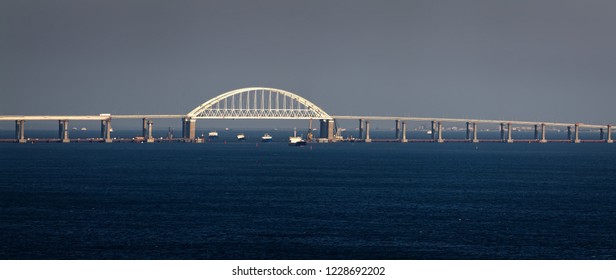 Crimean Bridge Road Across Kerch Strait With Leading Cargo Ships. Sea Gate To The Sea Of Azov