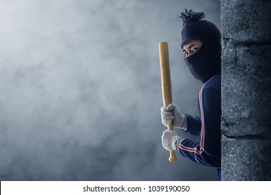 Criminal Or Bandit Holding A Baseball Bat.