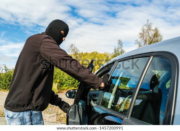 criminal car thief steal the\
car