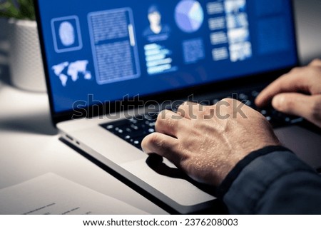 Criminal case investigation. Police or private detective using computer. Evidence document and profile of crime suspect with photo in laptop. FBI or CSI investigator. Officer and paperwork at desk.