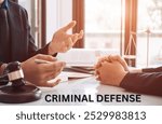 criminal defense, featuring a gavel, handcuffs, and legal documents on a desk. Ideal for content on criminal law, defense attorneys, and court proceedings.