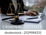 criminal defense, featuring a gavel, handcuffs, and legal documents on a desk. Ideal for content on criminal law, defense attorneys, and court proceedings.