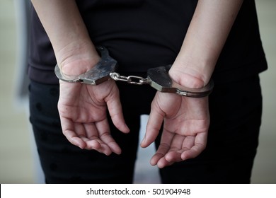 Criminal in handcuffs arrested for crimes.  - Shutterstock ID 501904948