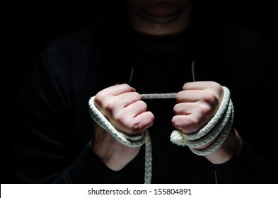 Criminal Hands Holding A Rope