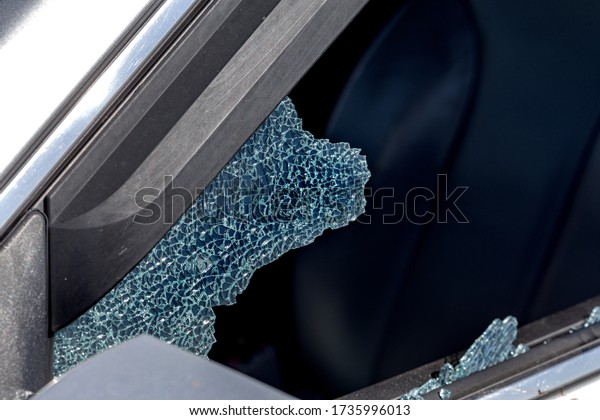 Criminal incident. Hacking a car. Broken\
driver\'s side window of car. Thieves smashed window of car with\
fragments inside, glass was scattered throughout. Crime - broken\
window and theft\
belongings