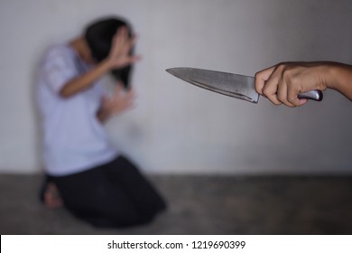 Criminal With Knife Attack Woman ,focus Hand.  