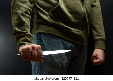 A Criminal With A Knife Weapon Threatens To Kill. Criminality, Crime, Robbery Thug