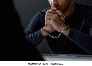 Criminal Man With Handcuffs In Interrogation Room Feeling Guilty After Committed A Crime